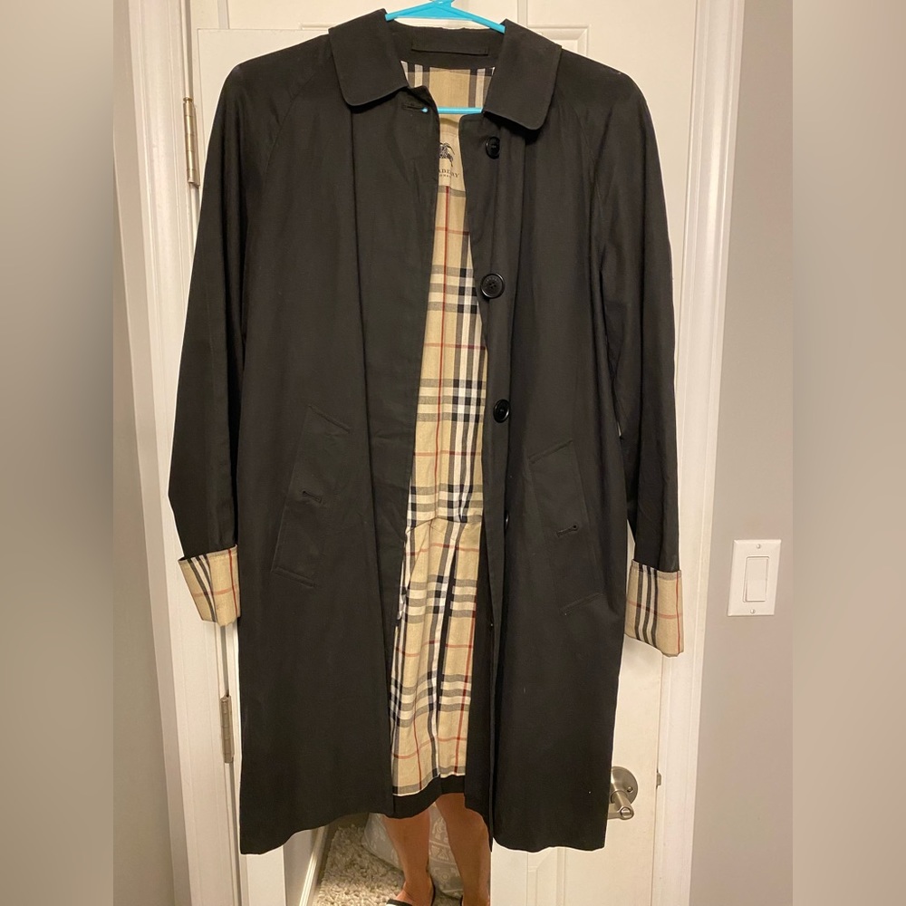 Vintage Burberry trench coat. Black with classic Burberry inner lining.